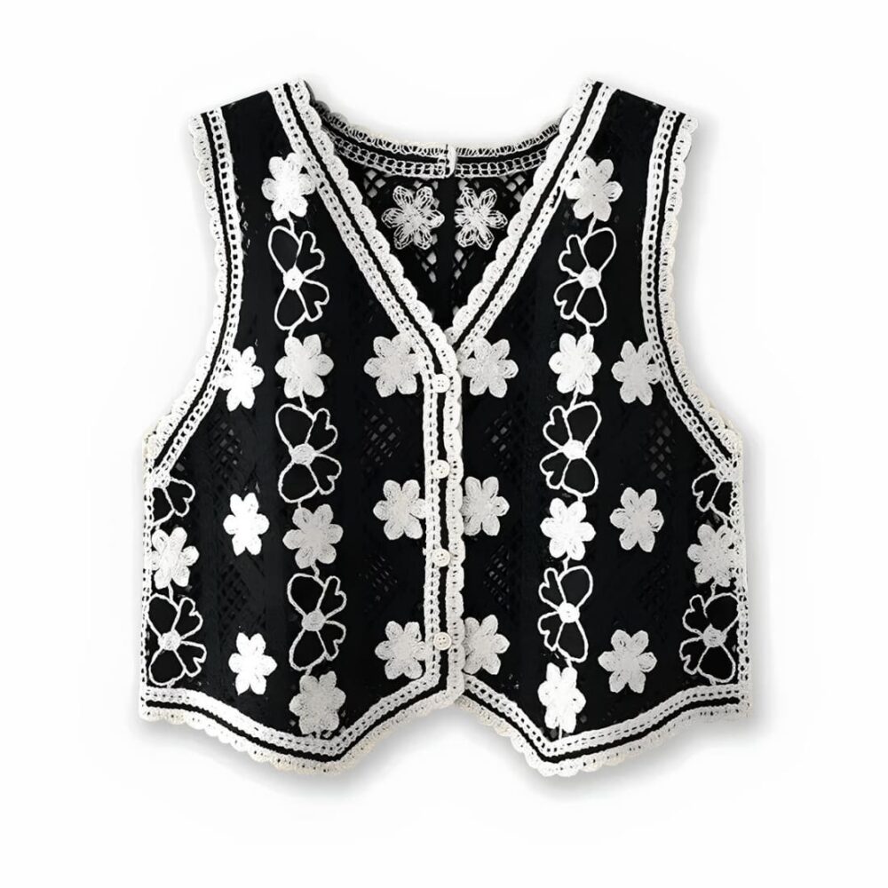 Gilet court sans manches avec motifs floraux brodés pour femme de couleurs noires et blanches.