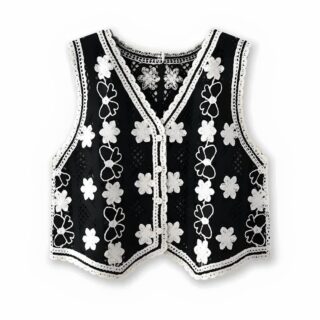 Gilet court sans manches avec motifs floraux brodés pour femme de couleurs noires et blanches.